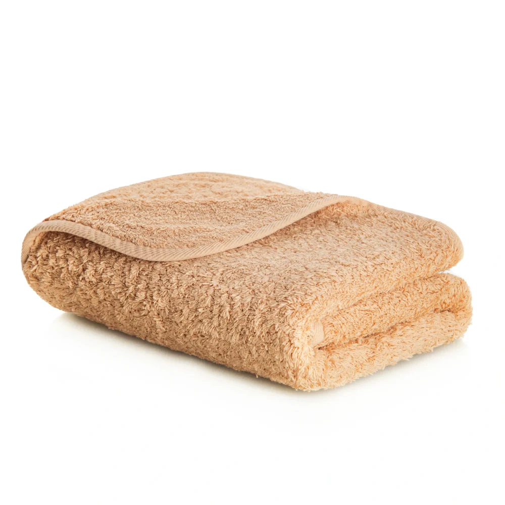 En exklusiv, fint vikt handduk modell Egoist från Graccioza i mjuk egyptisk bomull och färgtonen Toast.