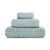 Exklusiva, fluffigt staplade frottéhanddukar Heaven i ljusturkos sea mist Zero Twist-bomull med unika rundade hörn.